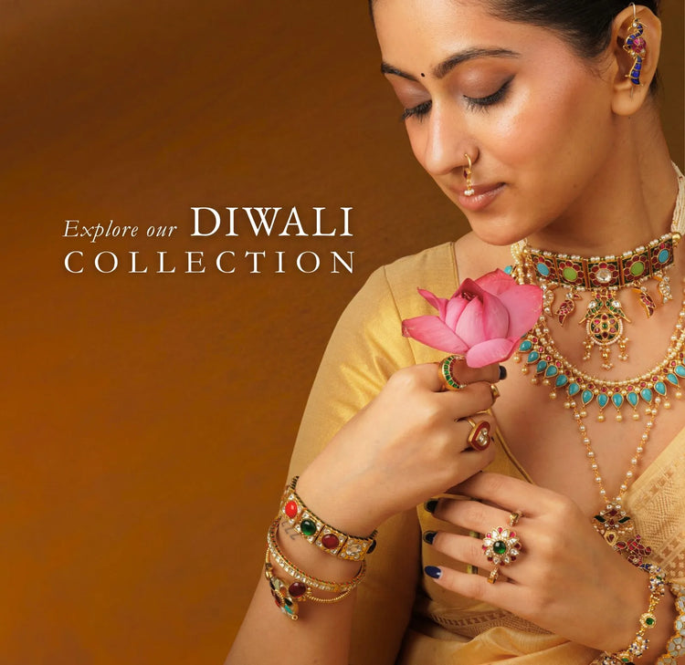 Woman wearing layered gemstone necklaces, colourful bangles and statement rings from Mortantra's Diwali jewellery collection, holding a pink lotus.